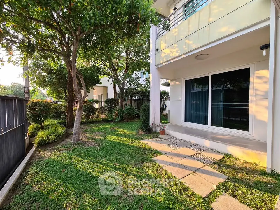 Charming garden view of modern home with lush greenery and spacious patio area
