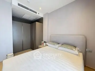 Modern bedroom with minimalist design and ample storage space