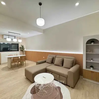 Modern living room with cozy sofa and stylish dining area