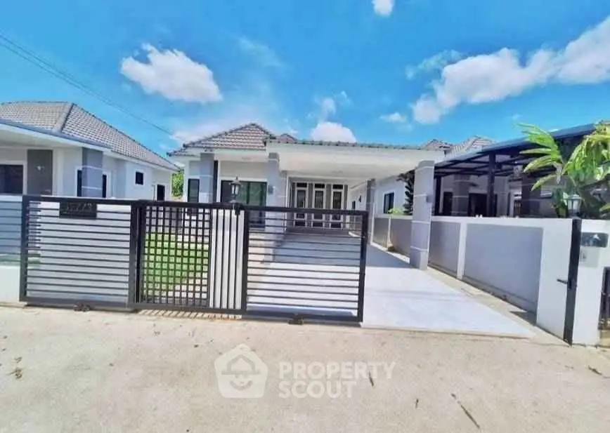 Charming single-story home with modern design and spacious driveway, perfect for family living.