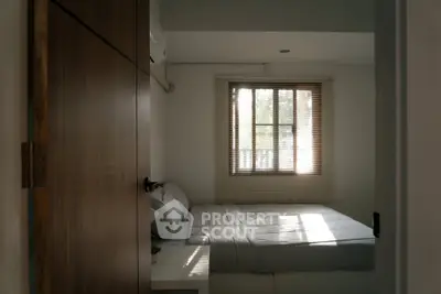 Cozy bedroom with natural light and modern decor
