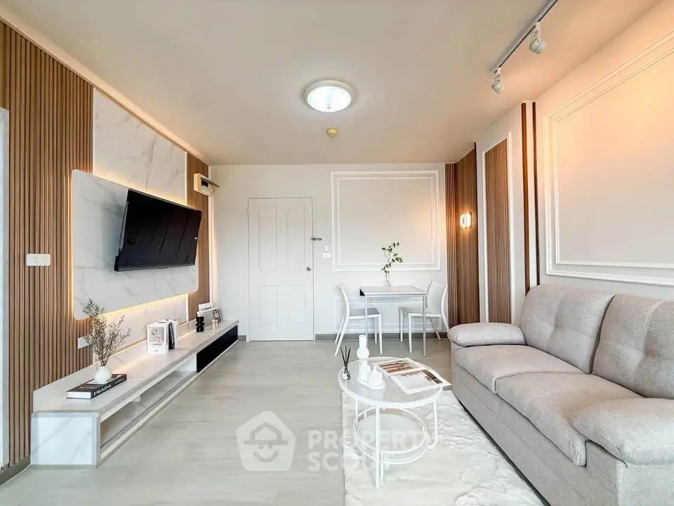 Modern living room with elegant decor and cozy seating area, perfect for relaxation and entertainment.