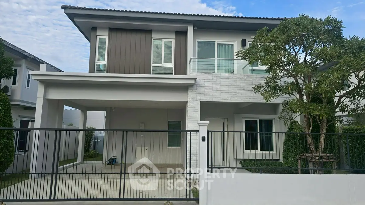 Modern two-story house with sleek design and spacious driveway