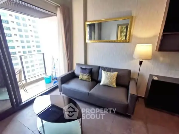 Modern living room with balcony view in high-rise apartment