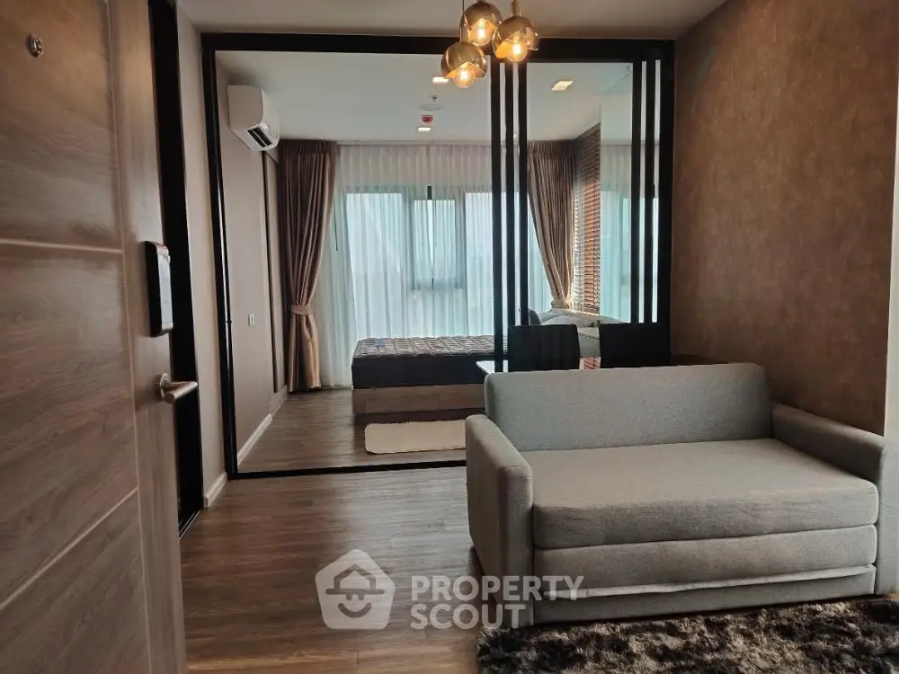 Modern apartment interior with cozy living area and stylish bedroom view.