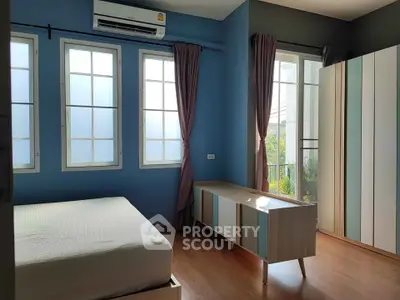 Bright and airy bedroom with modern decor and large windows