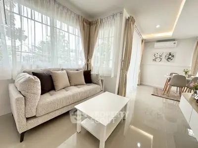 Bright and airy living room with modern decor and large windows