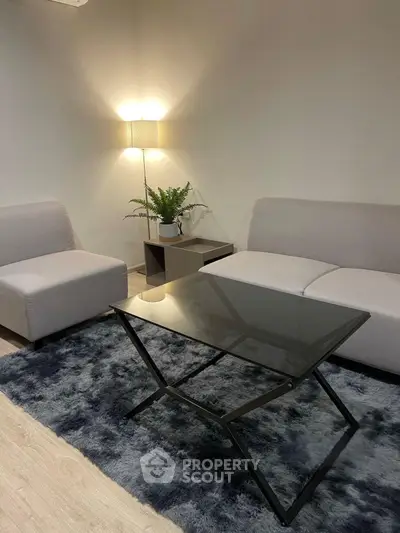 Modern living room with sleek furniture and cozy lighting