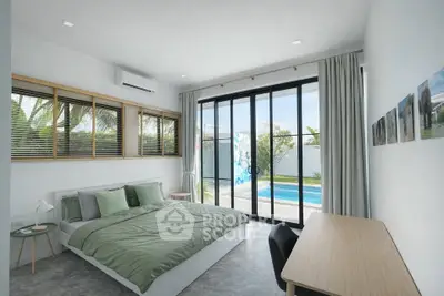 Modern bedroom with pool view, large windows, and stylish decor in a luxury home.