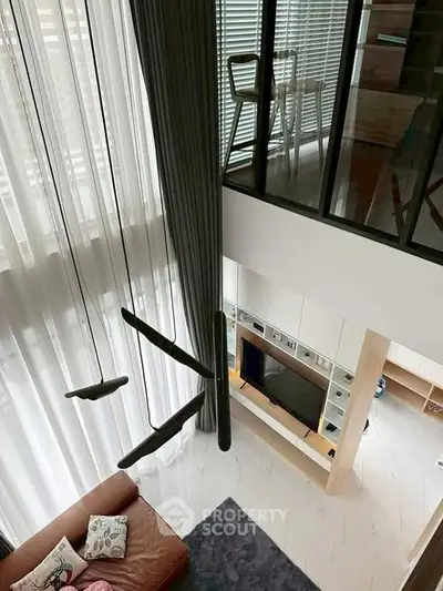 Modern duplex living room with high ceilings and stylish decor