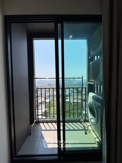 Modern apartment balcony with city view and laundry area