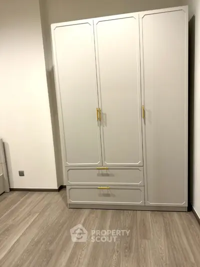 Modern bedroom with sleek wardrobe and stylish flooring