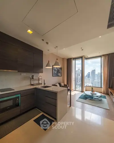 Modern open-layout kitchen and living room with city view in luxury apartment