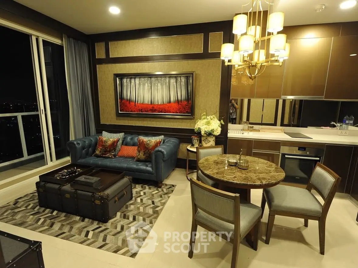 Luxurious living room with elegant decor and city view, featuring modern furniture and stylish lighting.