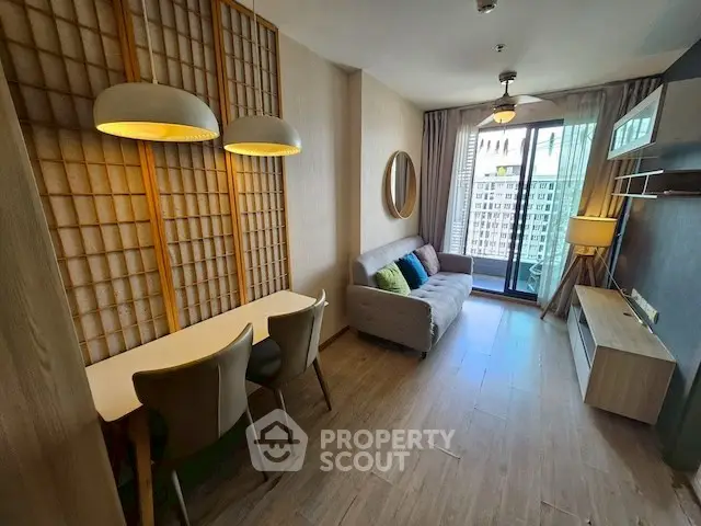 Modern living room with stylish decor and balcony view