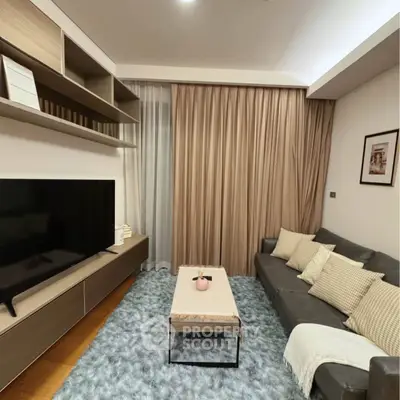 Stylish modern living room with cozy sofa and large TV