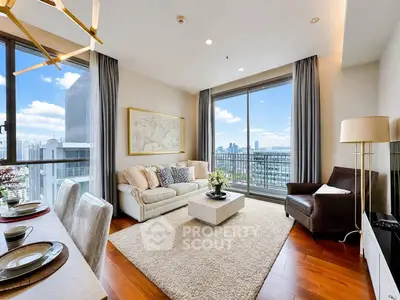 Luxurious living room with stunning city view, elegant decor, and ample natural light in modern apartment.