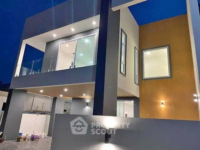 Modern architectural masterpiece with sleek design and illuminated facade, perfect for luxury living.