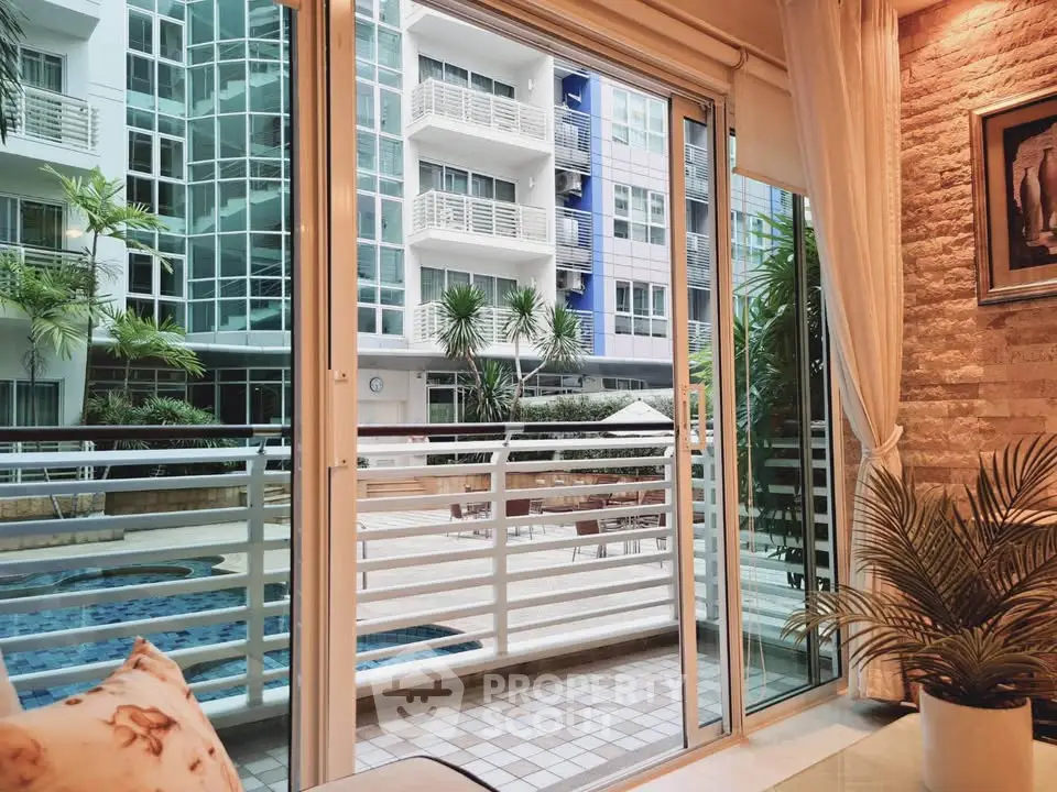 Luxurious apartment with pool view and modern glass facade, perfect for urban living.