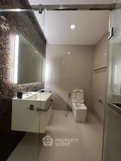 Modern bathroom with sleek design and glass shower enclosure
