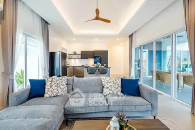 Spacious modern living room with open kitchen and stylish decor