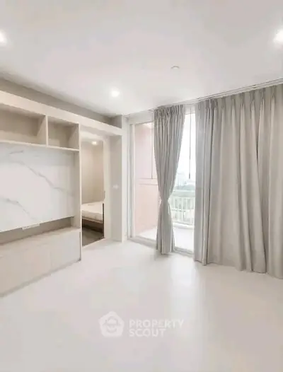 Spacious modern bedroom with large windows and elegant curtains, offering a serene ambiance and ample natural light.