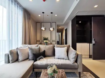 Modern living room with stylish decor and cozy seating in a contemporary apartment.