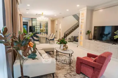 Luxurious living room with elegant chandelier and modern decor