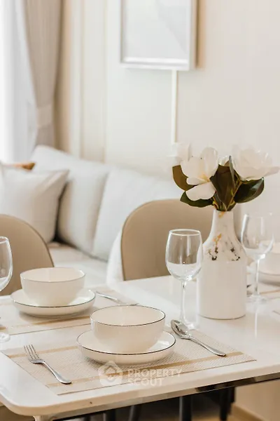 Elegant dining area with modern decor and cozy seating in a stylish apartment.