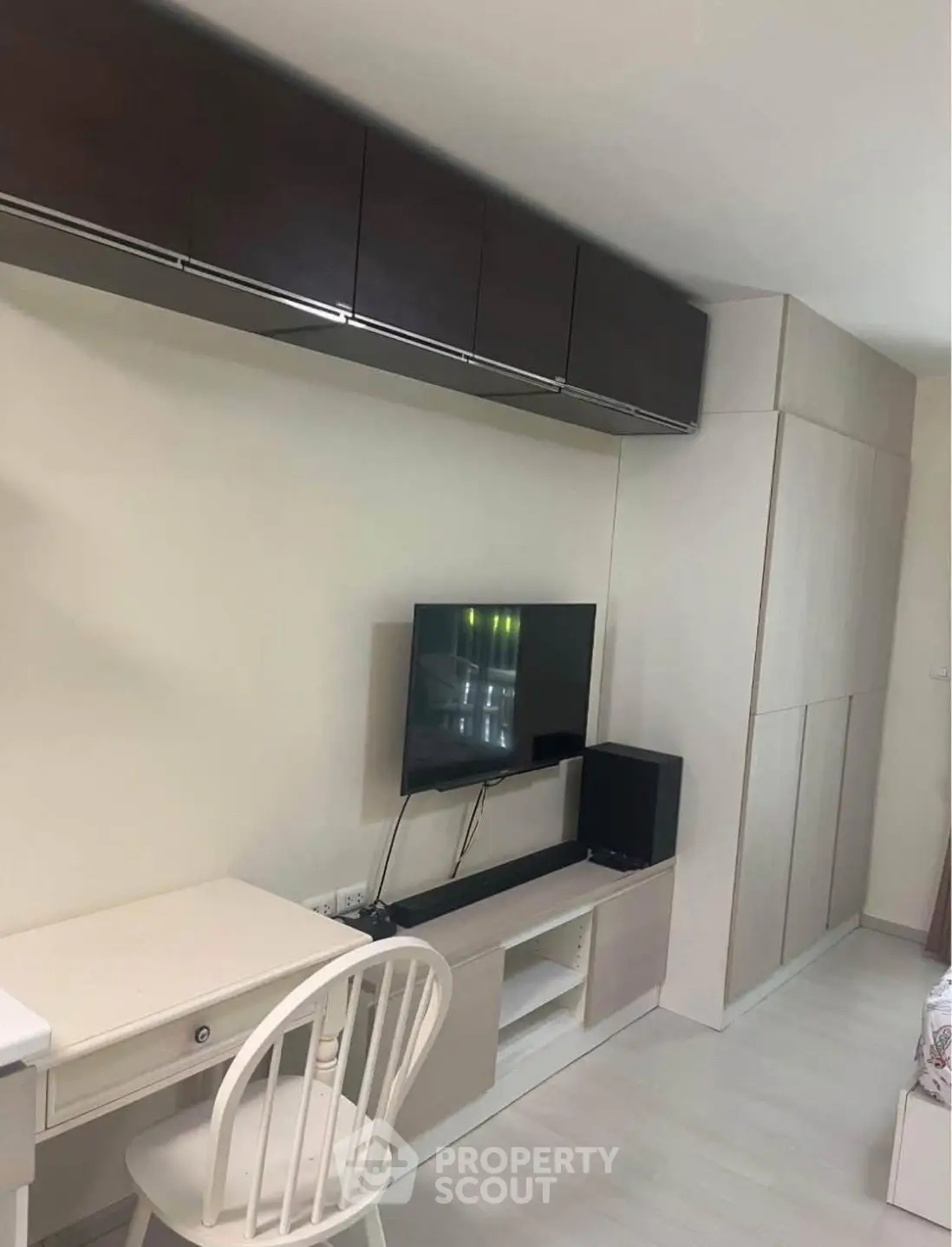 Modern living room with sleek TV setup and stylish furniture