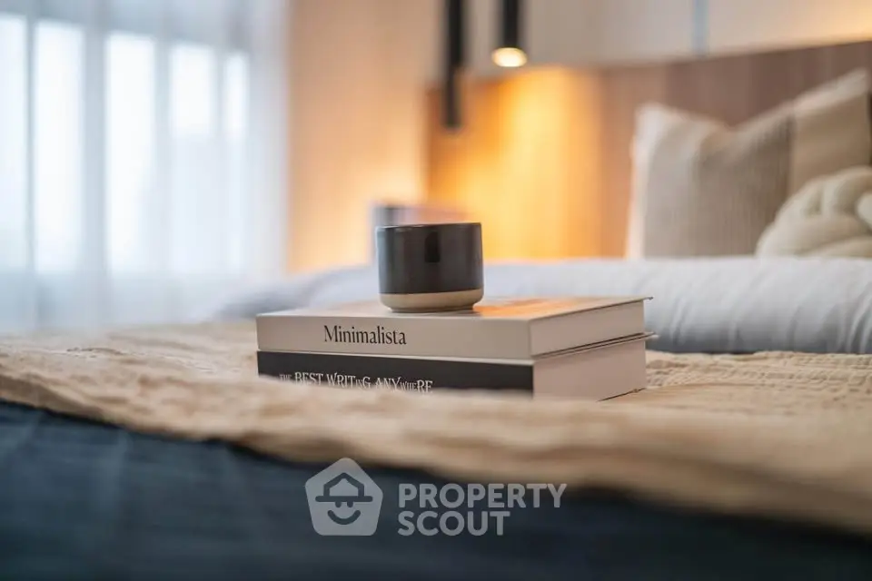 Cozy bedroom with stylish decor and soft lighting, perfect for relaxation.