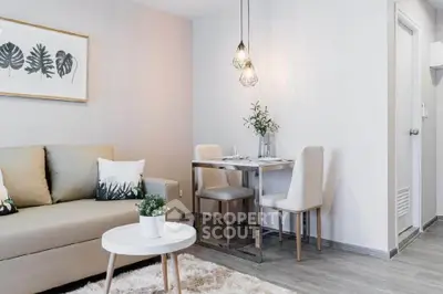 Modern living room with cozy seating and stylish dining area, perfect for urban living.