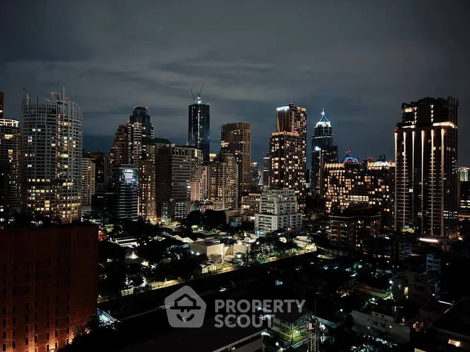 Stunning city skyline view with illuminated skyscrapers at night.