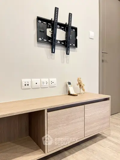 Modern living room with TV mount and sleek wooden cabinet