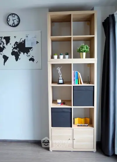 Modern living room with stylish shelving unit and world map decor