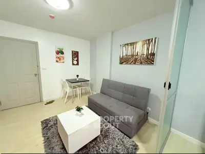 Modern living room with stylish decor and cozy furniture in a contemporary apartment.