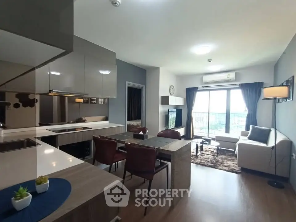 Modern open-layout living room with dining area and large window view