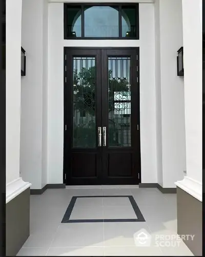 Elegant entrance with double doors and modern design