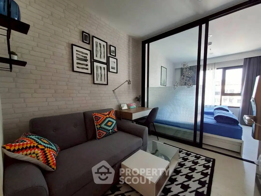 Modern living room with stylish decor and cozy bedroom view