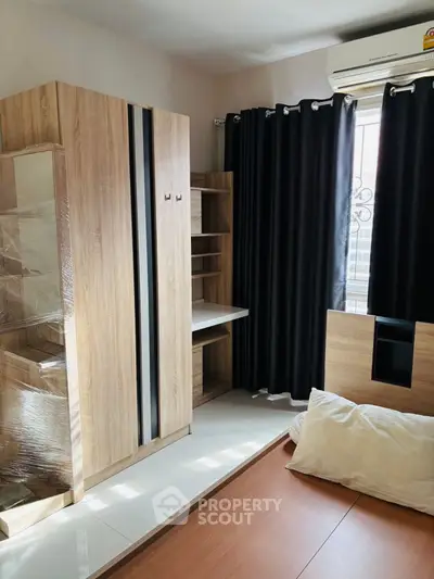 Modern bedroom with sleek wooden furniture and natural light