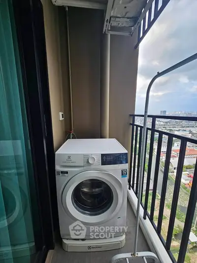 High-rise balcony with washing machine and stunning city view