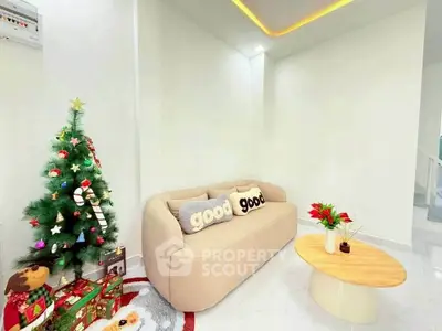Cozy living room with modern sofa and festive Christmas decor