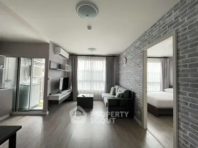 Modern living room with stylish decor and natural light in a contemporary apartment.
