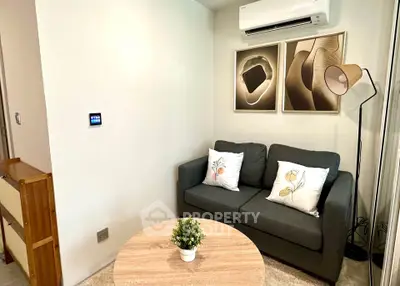 Cozy living room with modern decor and air conditioning