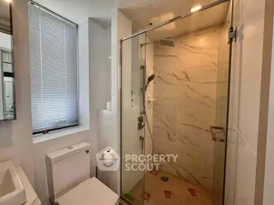 Modern bathroom with glass shower and sleek design