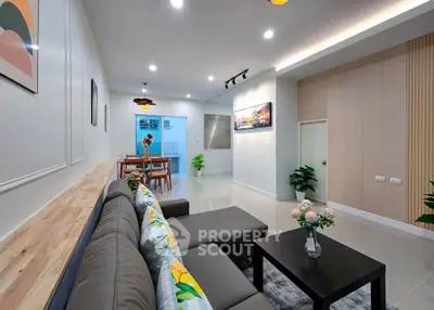 Spacious modern living room with stylish decor and open layout, perfect for entertaining guests.