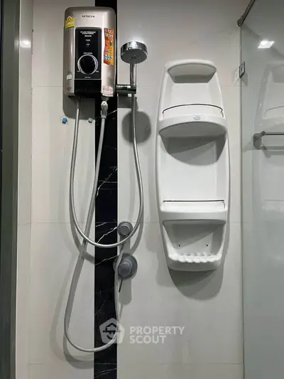 Modern bathroom with sleek shower unit and storage shelves