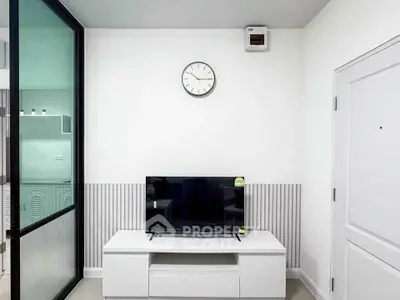 Modern living room with sleek TV setup and minimalist decor