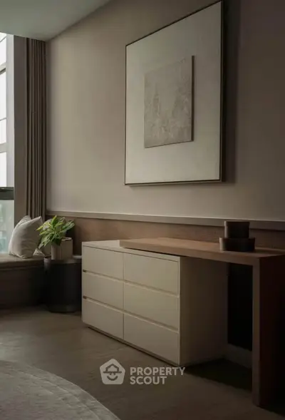 Elegant modern living room with stylish furniture and large window view.