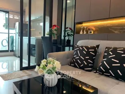 Modern living room with stylish decor and open kitchen layout
